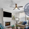 Spacious well lit living room with wood floors 